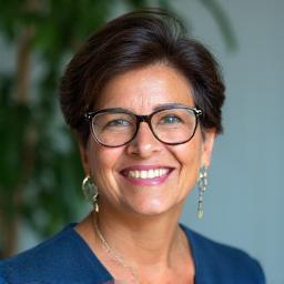 Portrait of Maria Rodriguez, a community leader and successful impact investor.